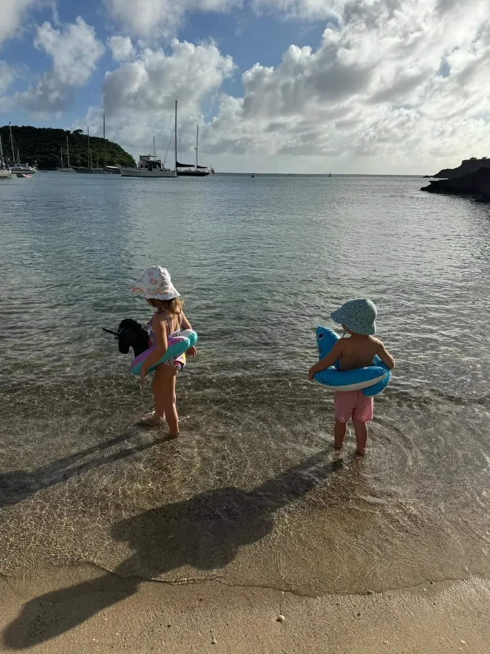 Family relaxing on the beach at The Inn at English Harbour, Antigua