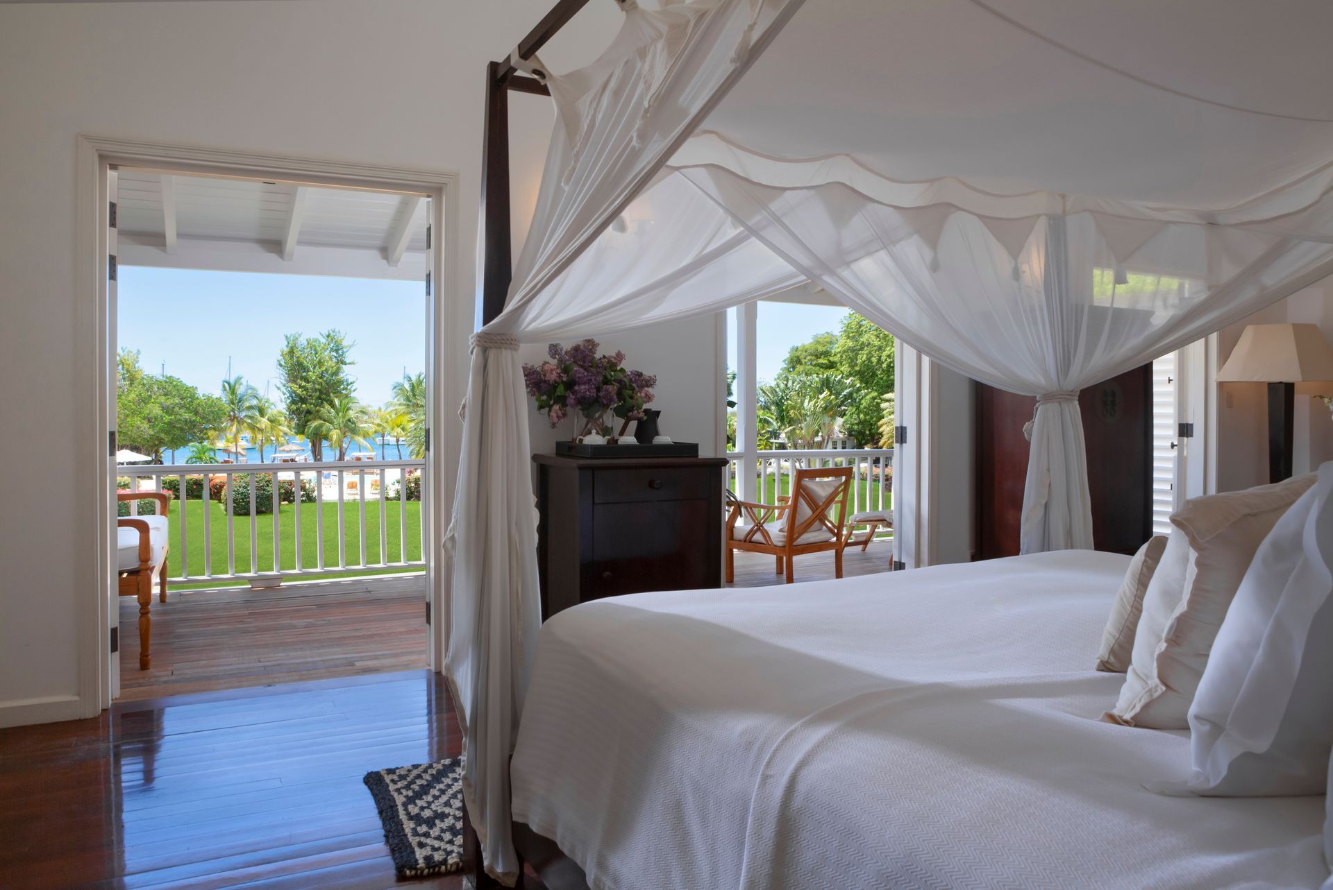 Deluxe Suite balcony with garden and pool views at The Inn at English Harbour