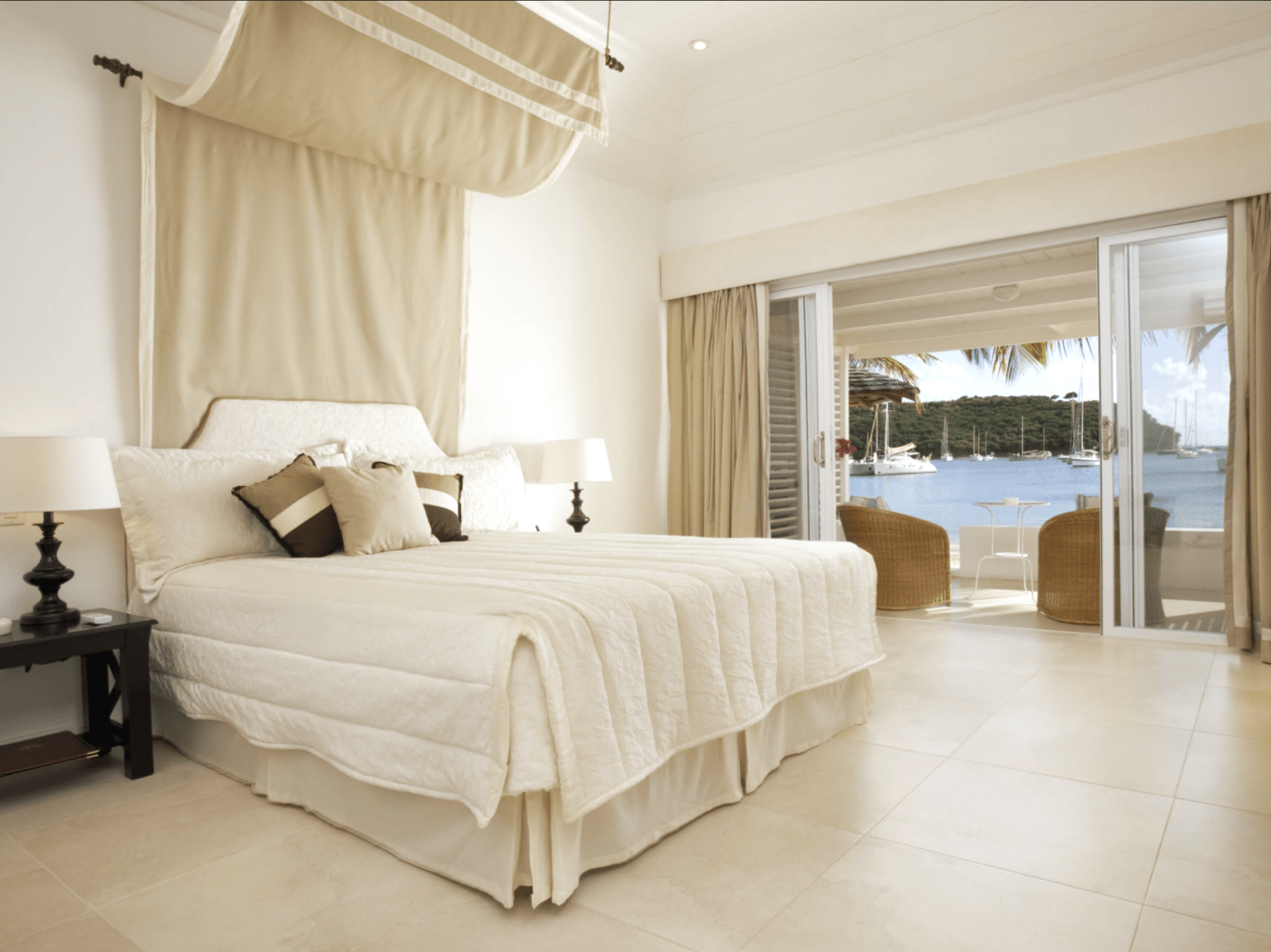 Junior Suite bedroom with four-poster canopy bed at The Inn at English Harbour