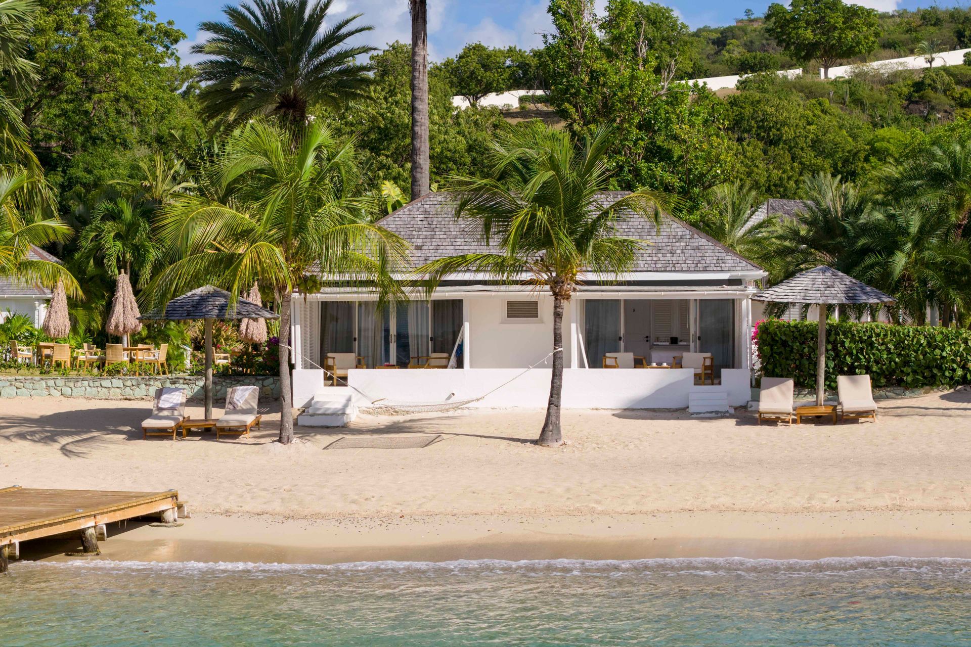 Beach Cabana suite exterior at The Inn at English Harbour with tropical gardens