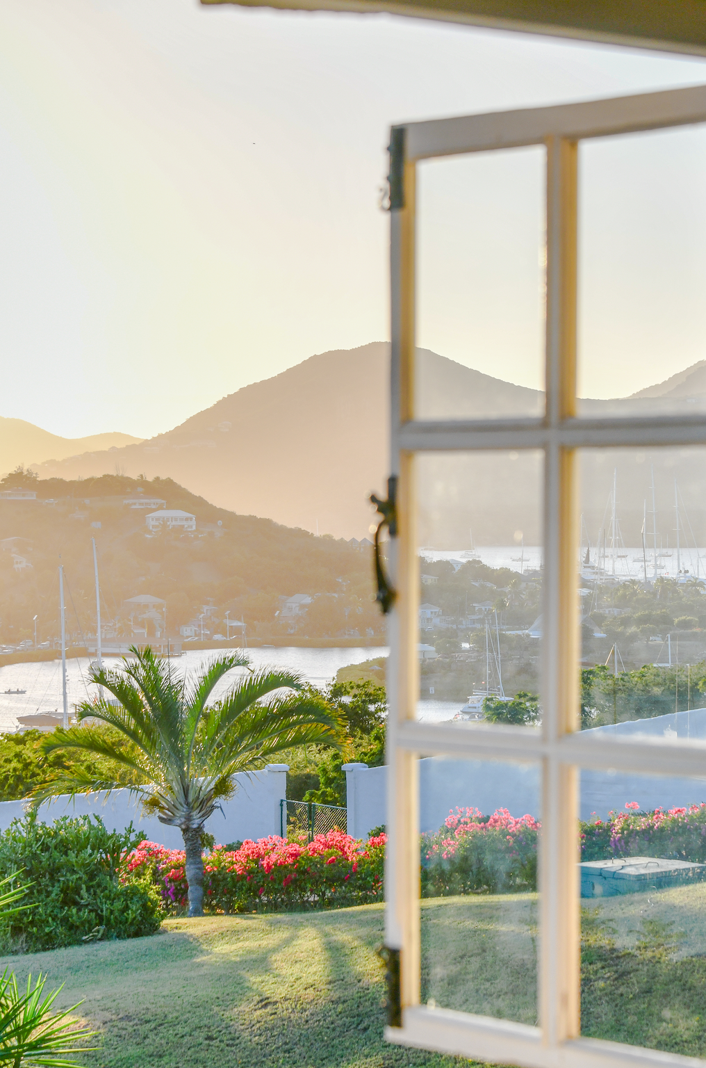 Sunset view through window at The Inn at English Harbour